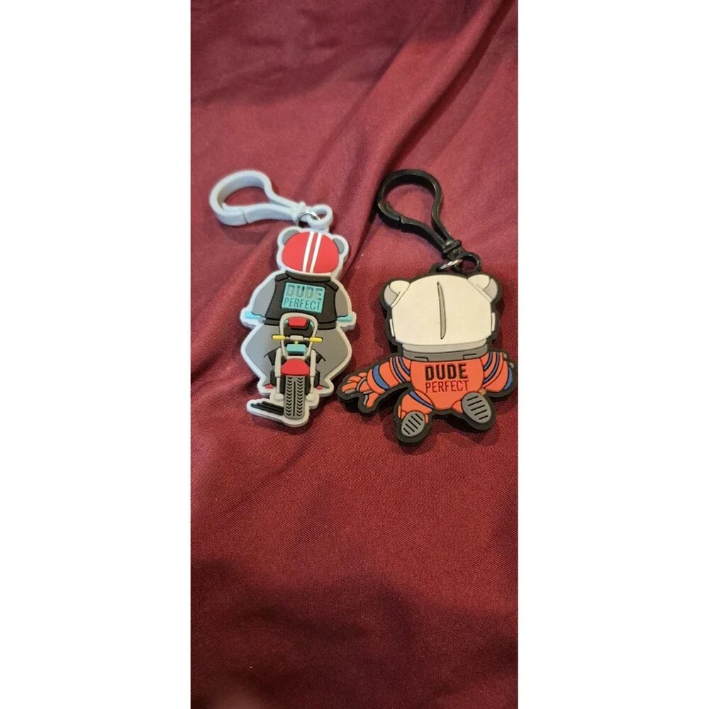 2 Dude Perfect Keychains Backpack Charms Motorcycle Bear Astronaut Kids EUC